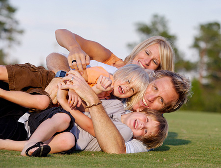 family-playing-in-grass
